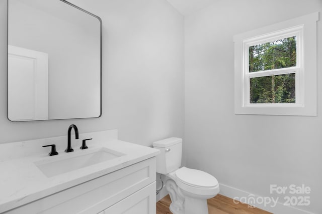 103 Churchill Dr, Kings Mountain, NC 28086 - half bath featuring vanity, toilet, wood finished floors, and baseboards