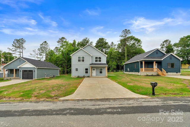 103 Churchill Dr, Kings Mountain, NC 28086 - view of front facade featuring an outbuilding, a front lawn, concrete driveway, and a garage