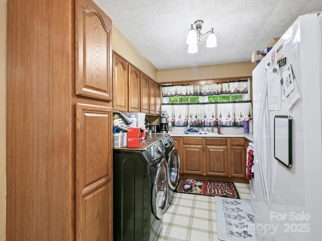 86 Hawk Haven Cv, Waynesville, NC 28786 - laundry room featuring washing machine and dryer, light flooring, and cabinet space