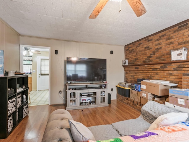 86 Hawk Haven Cv, Waynesville, NC 28786 - living area featuring ceiling fan, wood finished floors, ornamental molding, and wooden walls