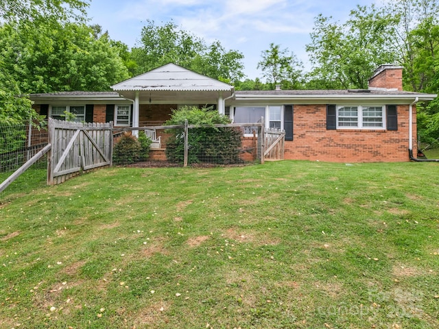 86 Hawk Haven Cv, Waynesville, NC 28786 - view of front of home featuring brick siding, a gate, and a chimney