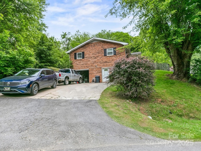 86 Hawk Haven Cv, Waynesville, NC 28786 - view of home's exterior featuring brick siding and asphalt driveway