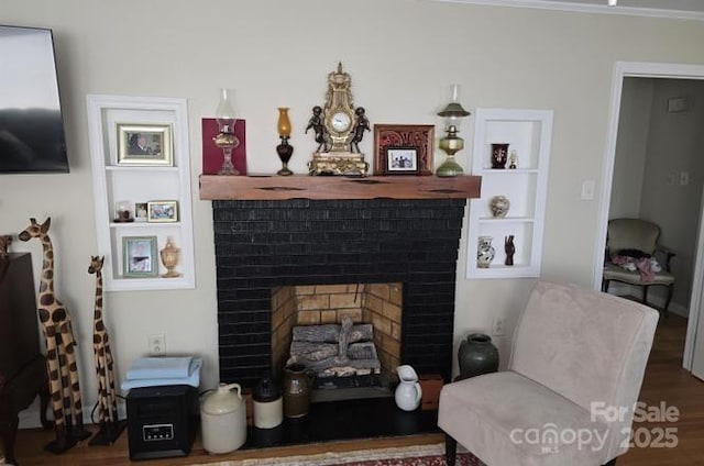 915 Wilkinsville Hwy, Gaffney, SC 29340 - living area featuring a brick fireplace, wood finished floors, and crown molding