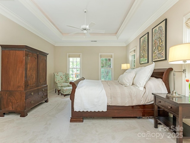 2516 Selwyn Ave, Charlotte, NC 28209 - bedroom with light colored carpet, a tray ceiling, crown molding, and a ceiling fan