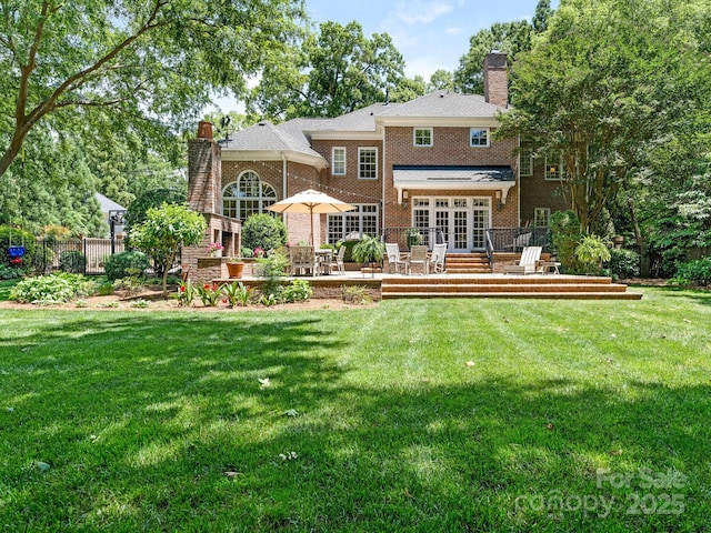 2516 Selwyn Ave, Charlotte, NC 28209 - back of house featuring a chimney, french doors, a deck, and brick siding