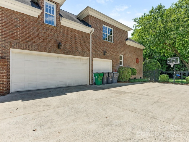 2516 Selwyn Ave, Charlotte, NC 28209 - view of side of property with concrete driveway, brick siding, and an attached garage