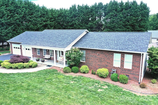 4646 River Run Cir, Hickory, NC 28602 - view of front of house featuring a shingled roof, brick siding, a garage, a front lawn, and driveway