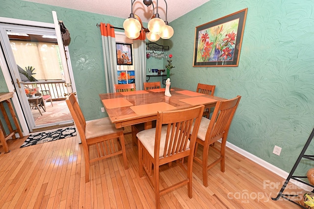 4646 River Run Cir, Hickory, NC 28602 - dining area featuring wallpapered walls, light wood-type flooring, a chandelier, and baseboards