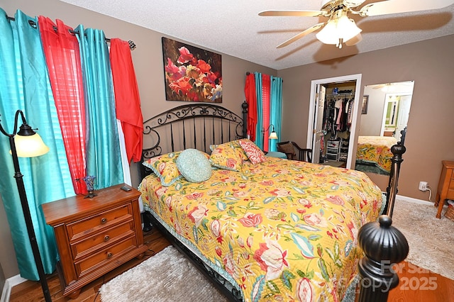 4646 River Run Cir, Hickory, NC 28602 - bedroom with a walk in closet, baseboards, a closet, and ceiling fan
