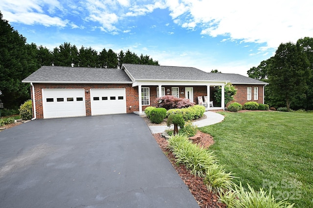 4646 River Run Cir, Hickory, NC 28602 - view of front of home featuring an attached garage, a front lawn, asphalt driveway, brick siding, and a porch
