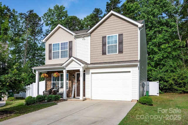 7527 Finnigan Rd, Charlotte, NC 28215 - traditional home with a porch, an attached garage, and concrete driveway