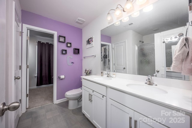 7527 Finnigan Rd, Charlotte, NC 28215 - full bathroom with a shower stall, double vanity, toilet, and baseboards