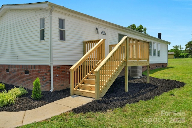 5606 S Rocky River Rd, Monroe, NC 28112 - rear view of property featuring crawl space, central AC unit, a yard, and a wooden deck