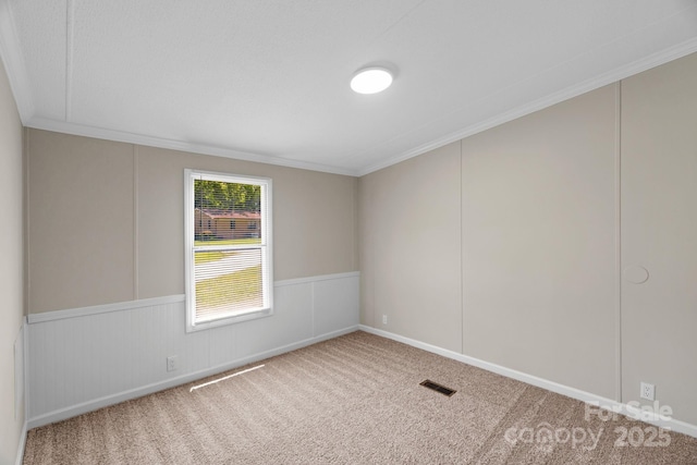 5606 S Rocky River Rd, Monroe, NC 28112 - carpeted empty room featuring ornamental molding and a wainscoted wall