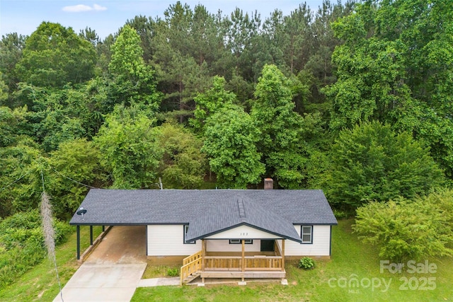103 Fleetwood Rd, York, SC 29745 - view of front of home with driveway, an attached carport, a chimney, a front lawn, and a shingled roof
