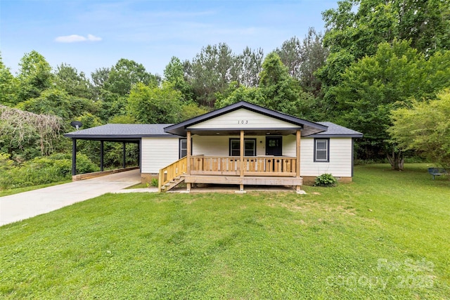 103 Fleetwood Rd, York, SC 29745 - view of front of house with covered porch, a front lawn, concrete driveway, and an attached carport