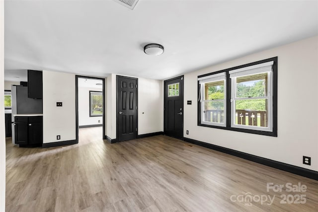 103 Fleetwood Rd, York, SC 29745 - unfurnished living room with light wood-style flooring and baseboards