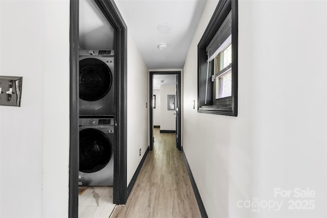 103 Fleetwood Rd, York, SC 29745 - washroom with stacked washer / drying machine, baseboards, and light wood-type flooring