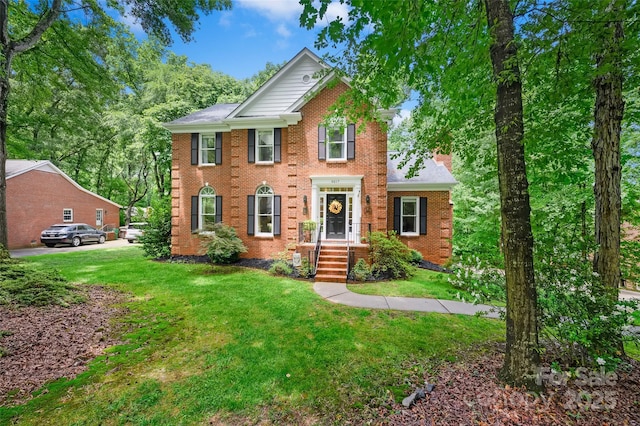 8217 Lansford Rd, Charlotte, NC 28277 - colonial home with brick siding and a front lawn