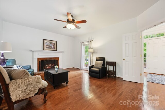 8217 Lansford Rd, Charlotte, NC 28277 - living area featuring hardwood / wood-style floors, a fireplace, and a ceiling fan