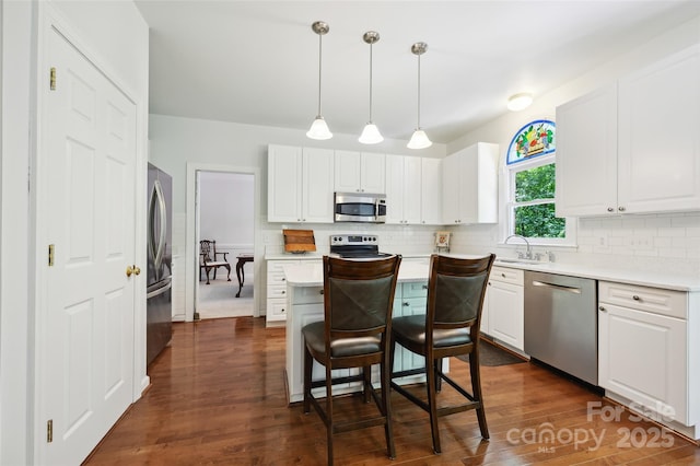 8217 Lansford Rd, Charlotte, NC 28277 - kitchen featuring appliances with stainless steel finishes, tasteful backsplash, light countertops, and white cabinetry