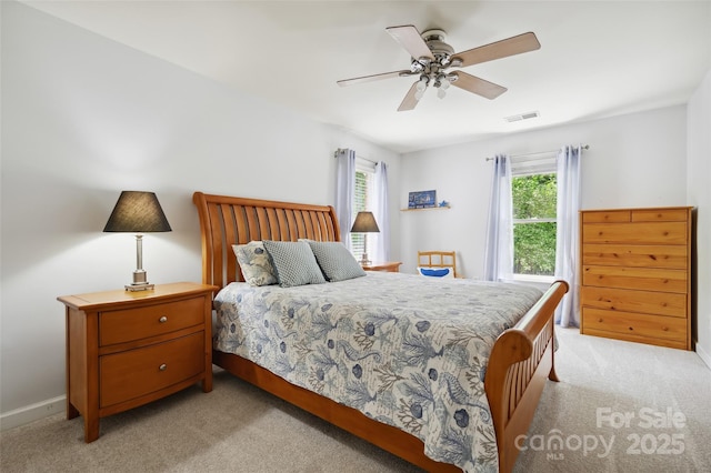 8217 Lansford Rd, Charlotte, NC 28277 - bedroom with light colored carpet and a ceiling fan