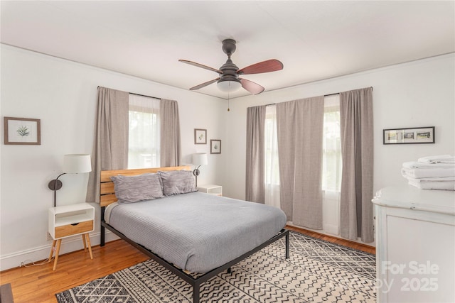 7 Grove St, Weaverville, NC 28787 - bedroom with wood finished floors, ceiling fan, and baseboards
