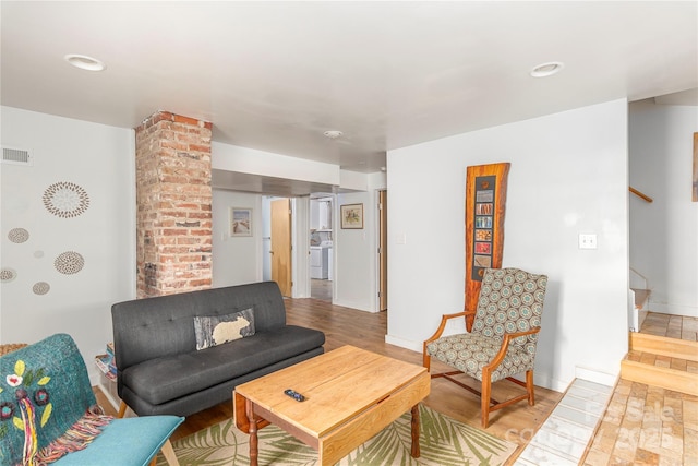 7 Grove St, Weaverville, NC 28787 - living area featuring stairway, wood finished floors, baseboards, and washer / clothes dryer