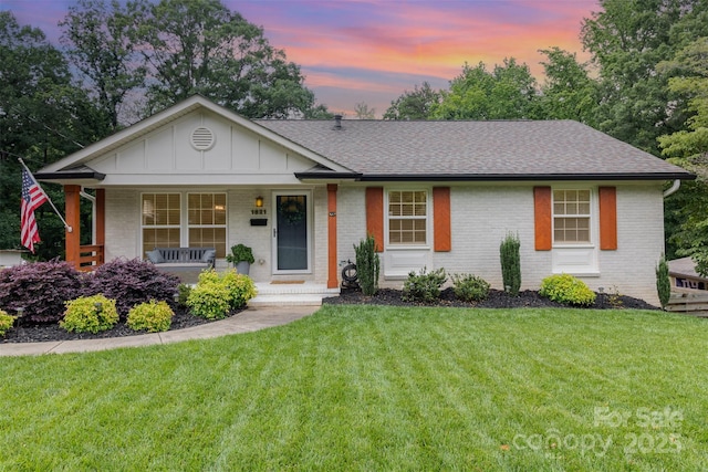 1621 Brookdale Ave, Charlotte, NC 28210 - ranch-style home featuring roof with shingles, board and batten siding, brick siding, and covered porch