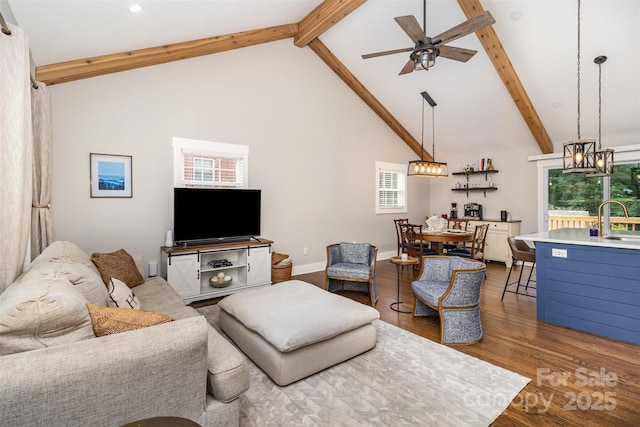 1621 Brookdale Ave, Charlotte, NC 28210 - living area with wood finished floors, ceiling fan, beam ceiling, healthy amount of natural light, and high vaulted ceiling