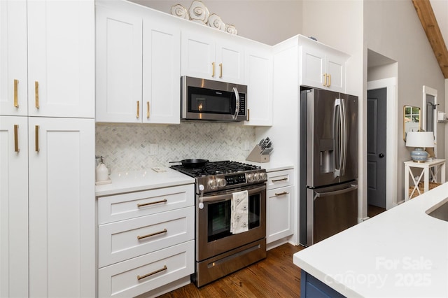 1621 Brookdale Ave, Charlotte, NC 28210 - kitchen with stainless steel appliances, light countertops, tasteful backsplash, and white cabinets