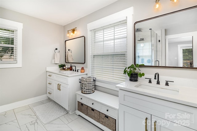 1621 Brookdale Ave, Charlotte, NC 28210 - bathroom with a stall shower, two vanities, marble look tiles, and baseboards
