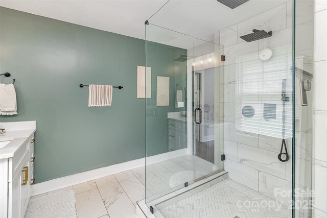 1621 Brookdale Ave, Charlotte, NC 28210 - bathroom with vanity, marble finish floors, a shower stall, baseboards, and french doors