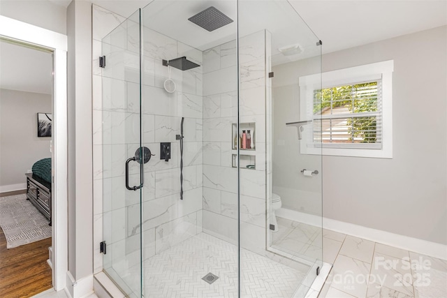 1621 Brookdale Ave, Charlotte, NC 28210 - bathroom with ensuite bath, a shower stall, baseboards, and toilet