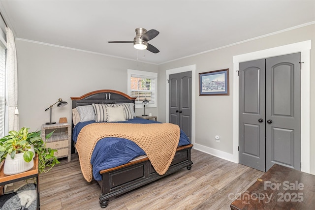 1621 Brookdale Ave, Charlotte, NC 28210 - bedroom featuring ornamental molding, light wood-type flooring, baseboards, and ceiling fan