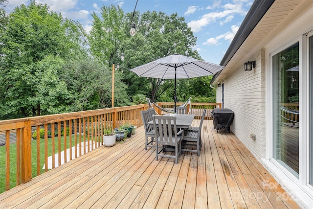 1621 Brookdale Ave, Charlotte, NC 28210 - wooden deck with outdoor dining area, grilling area, and a lawn