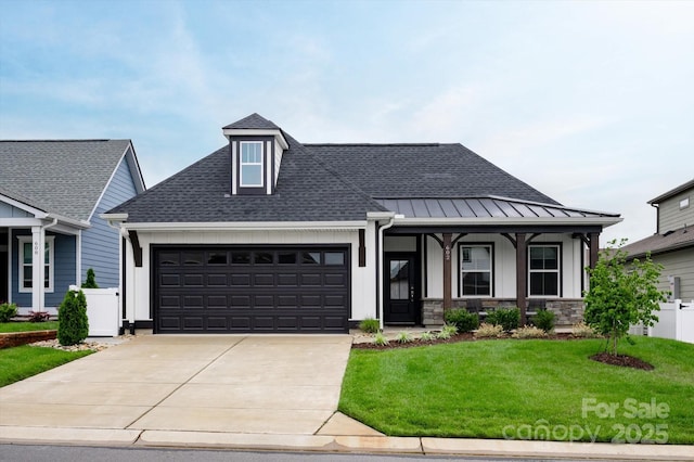 602 Compass Dr, Denver, NC 28037 - view of front of home with an attached garage, concrete driveway, a standing seam roof, a shingled roof, and board and batten siding
