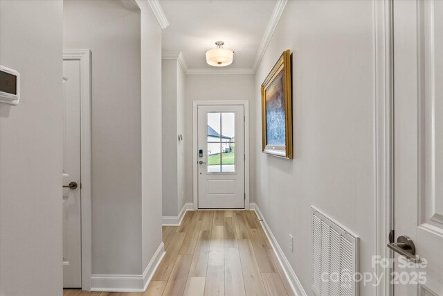 602 Compass Dr, Denver, NC 28037 - entryway featuring baseboards, ornamental molding, and light wood-style floors
