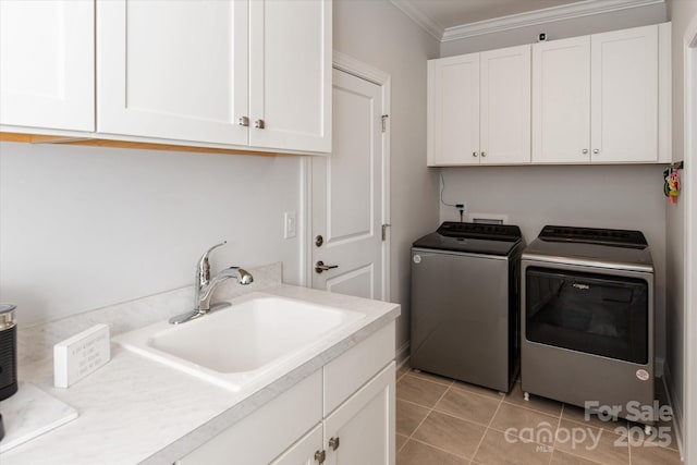 602 Compass Dr, Denver, NC 28037 - laundry area featuring washing machine and clothes dryer, cabinet space, ornamental molding, and light tile patterned floors