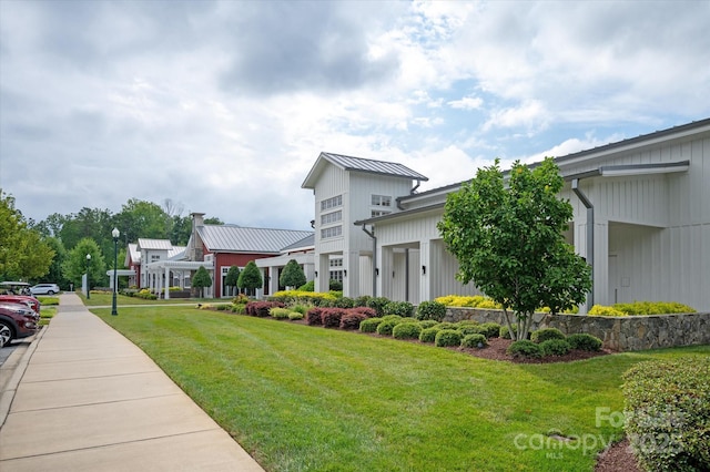 602 Compass Dr, Denver, NC 28037 - view of home's exterior with a lawn, metal roof, and a standing seam roof