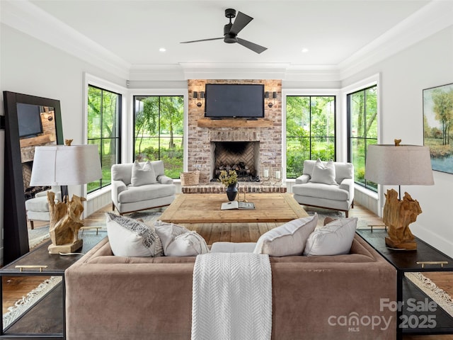 146 Lower Brush Creek Rd, Fletcher, NC 28732 - living area with a brick fireplace, plenty of natural light, wood finished floors, ornamental molding, and ceiling fan