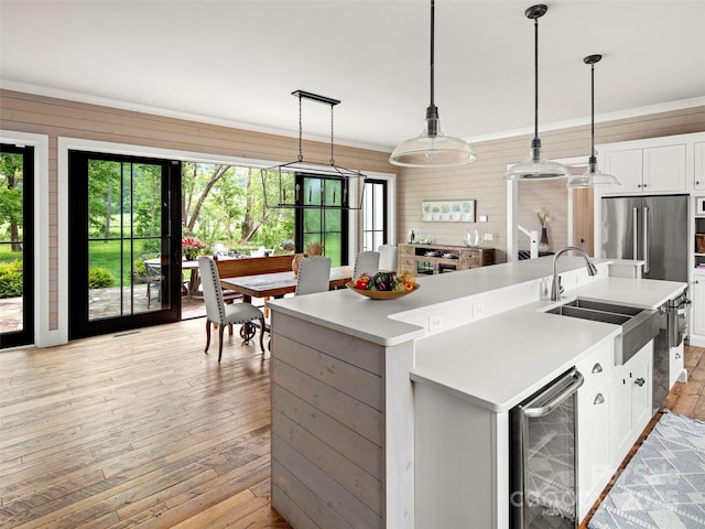 146 Lower Brush Creek Rd, Fletcher, NC 28732 - kitchen with wine cooler, a sink, light wood finished floors, and light countertops