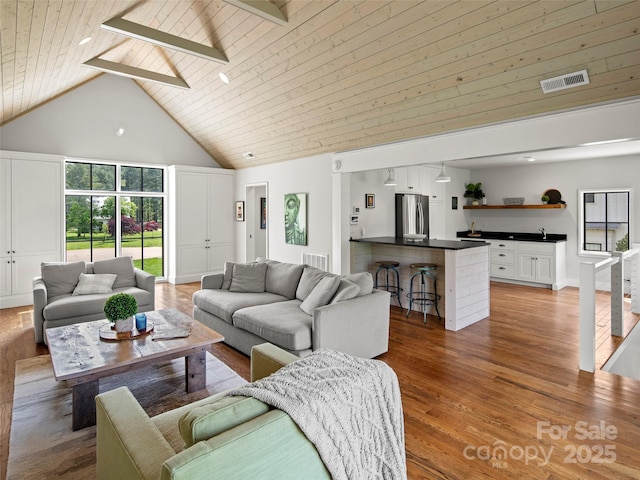 146 Lower Brush Creek Rd, Fletcher, NC 28732 - living area with high vaulted ceiling, light wood-style flooring, wooden ceiling, and bar area