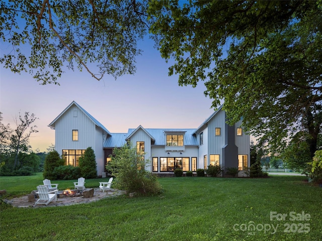 146 Lower Brush Creek Rd, Fletcher, NC 28732 - back of house with an outdoor fire pit, a yard, board and batten siding, a standing seam roof, and metal roof