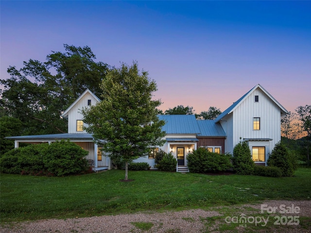 146 Lower Brush Creek Rd, Fletcher, NC 28732 - modern farmhouse style home featuring board and batten siding, a front yard, metal roof, and entry steps