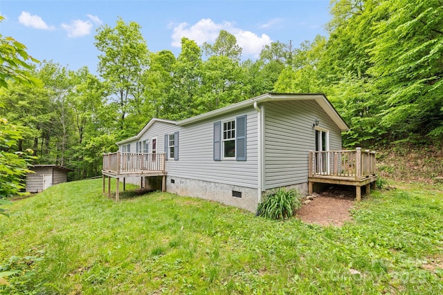 100 Bettys Dr, Waynesville, NC 28786 - view of side of home with a deck, crawl space, and a yard
