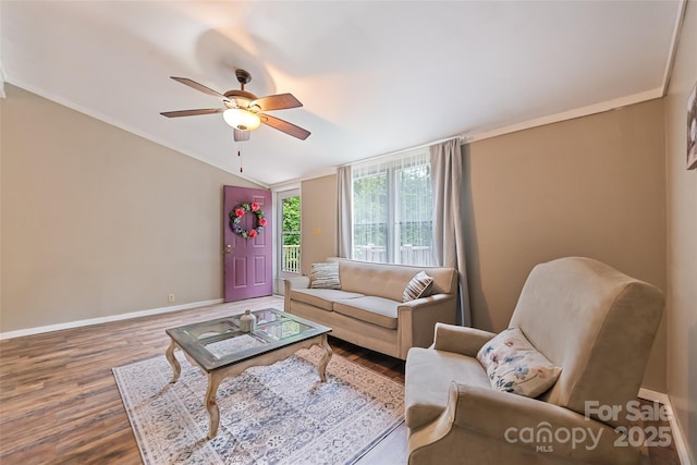 100 Bettys Dr, Waynesville, NC 28786 - living room featuring wood finished floors, ceiling fan, baseboards, vaulted ceiling, and crown molding