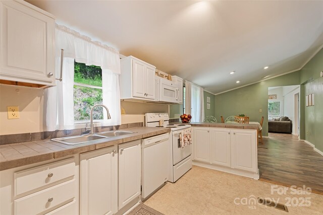 100 Bettys Dr, Waynesville, NC 28786 - kitchen featuring white appliances, a sink, crown molding, healthy amount of natural light, and white cabinetry