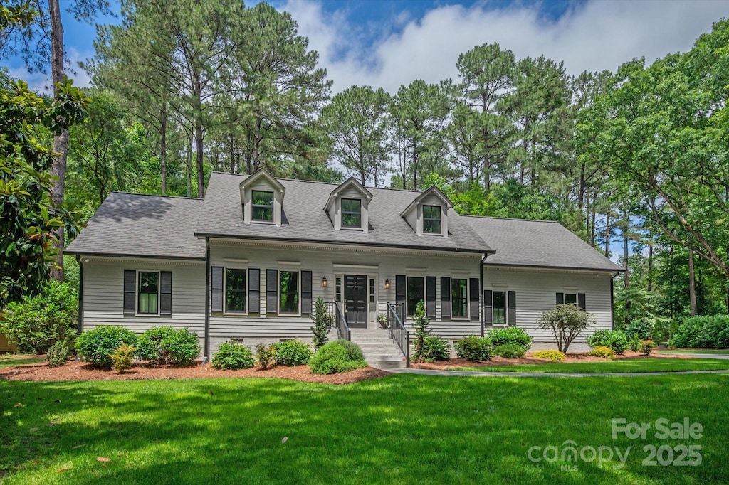 516 Amanda Dr, Weddington, NC 28104 - new england style home featuring a front lawn and a shingled roof