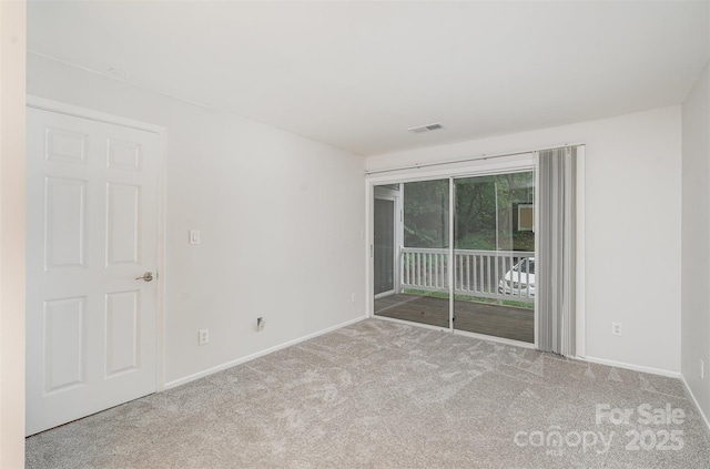 2512 Cranbrook Ln Unit 9, Charlotte, NC 28207 - spare room featuring carpet floors and baseboards